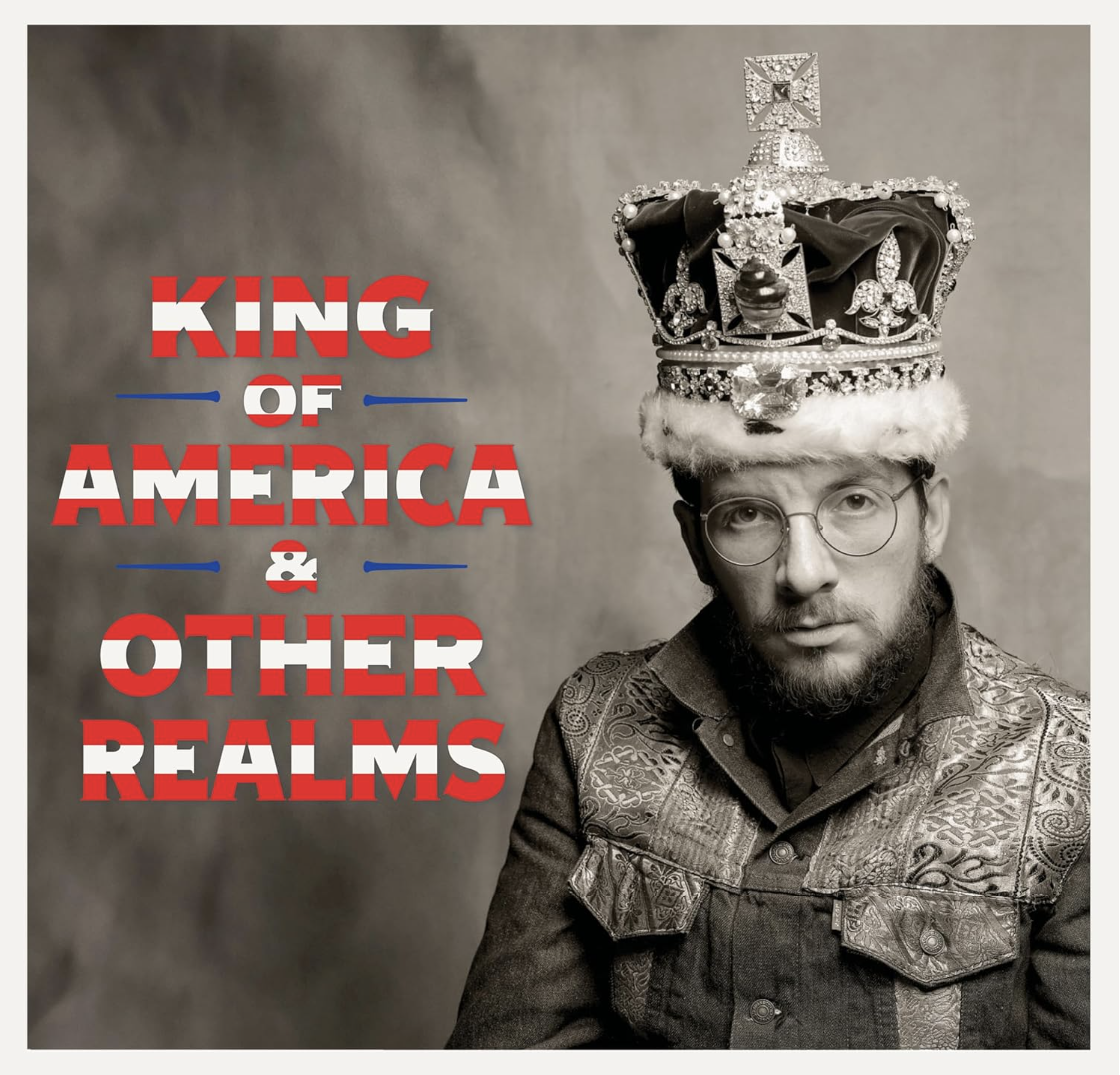 An album cover featuring a white man wearing a denim jacket and an elaborate crown.