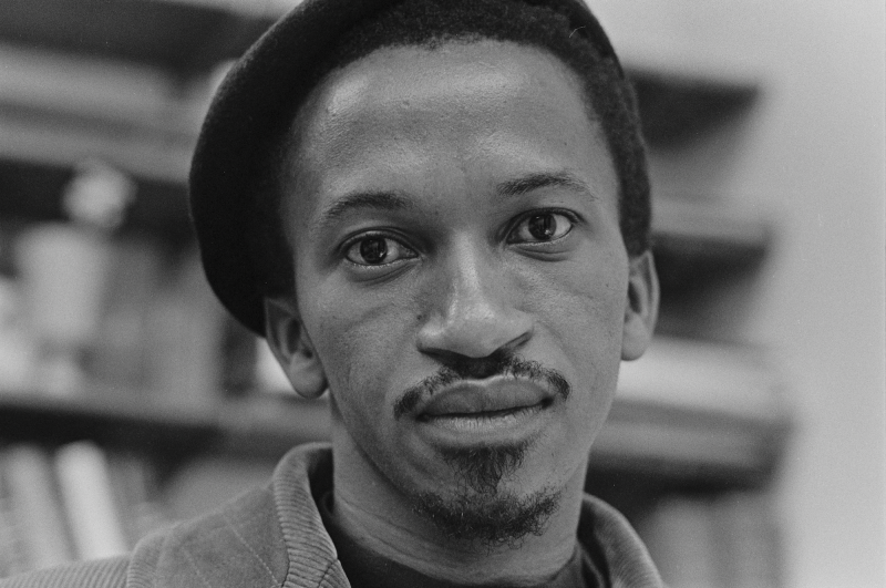 A close up of a young Black man wearing a beret.