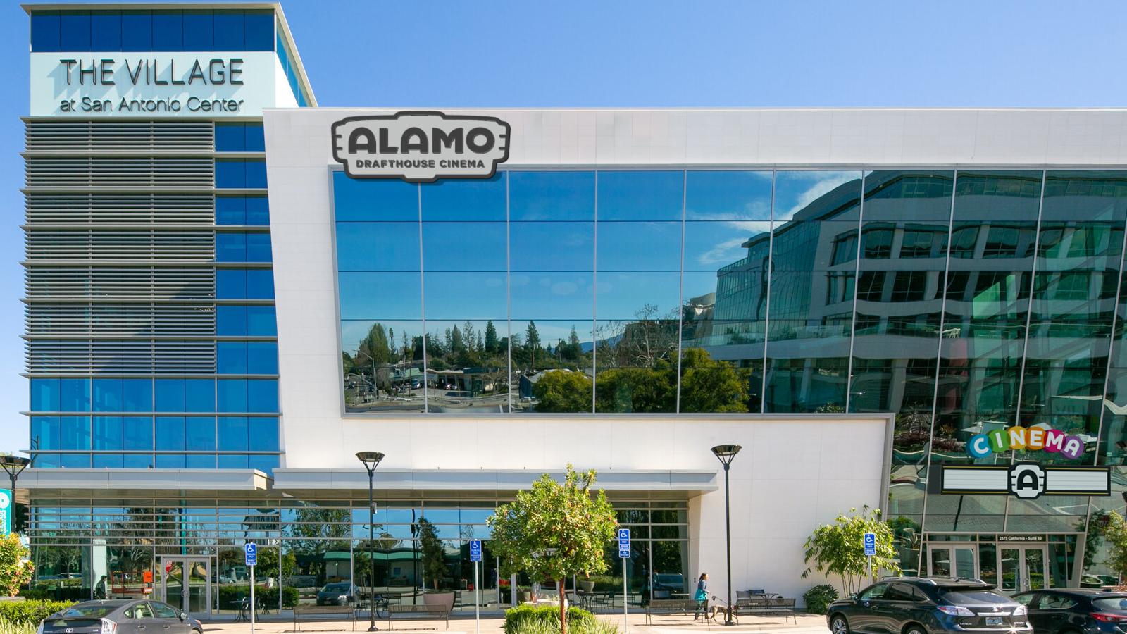 glass facade of building with theater name on top