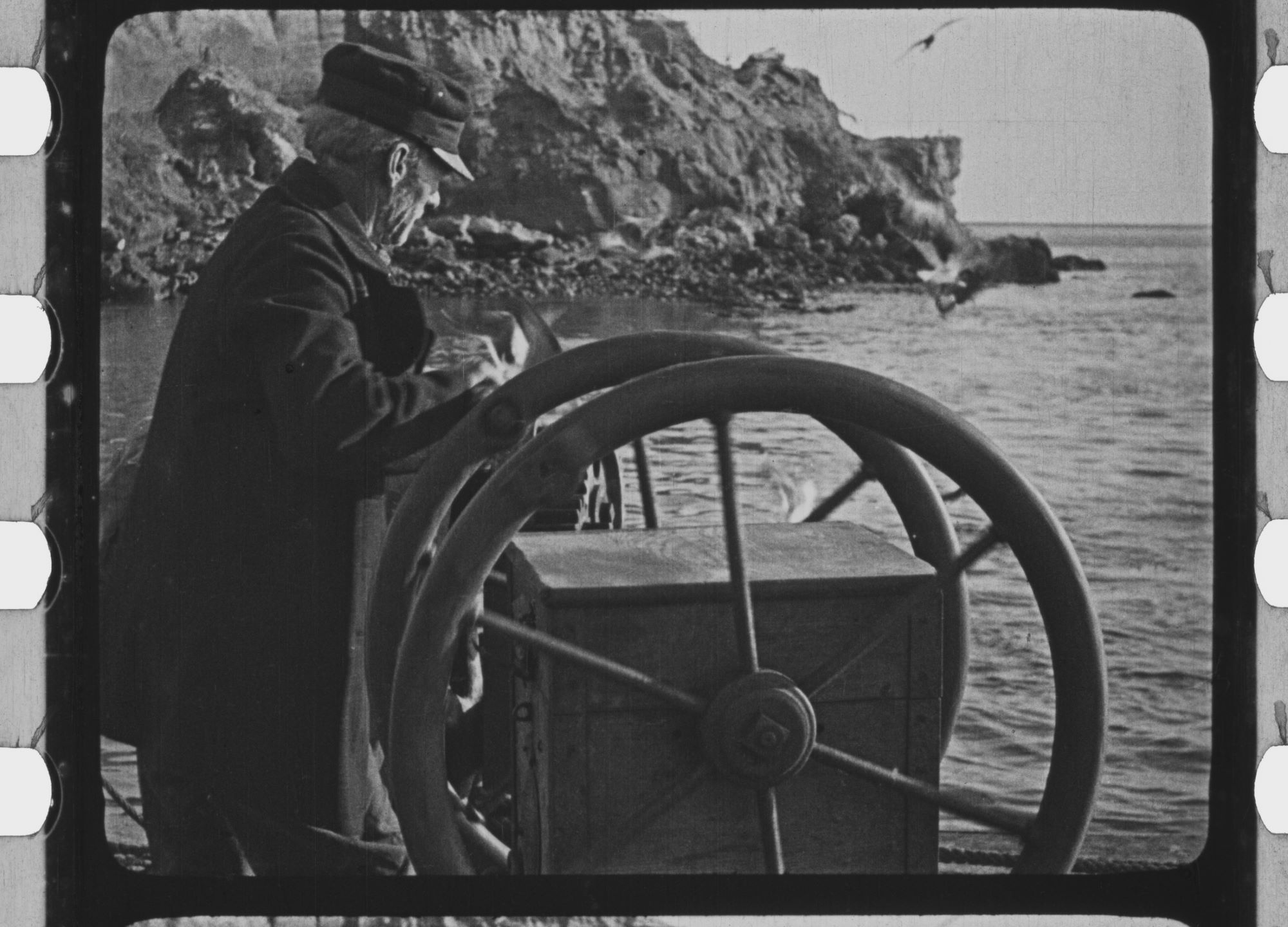 man at two wheels on boat