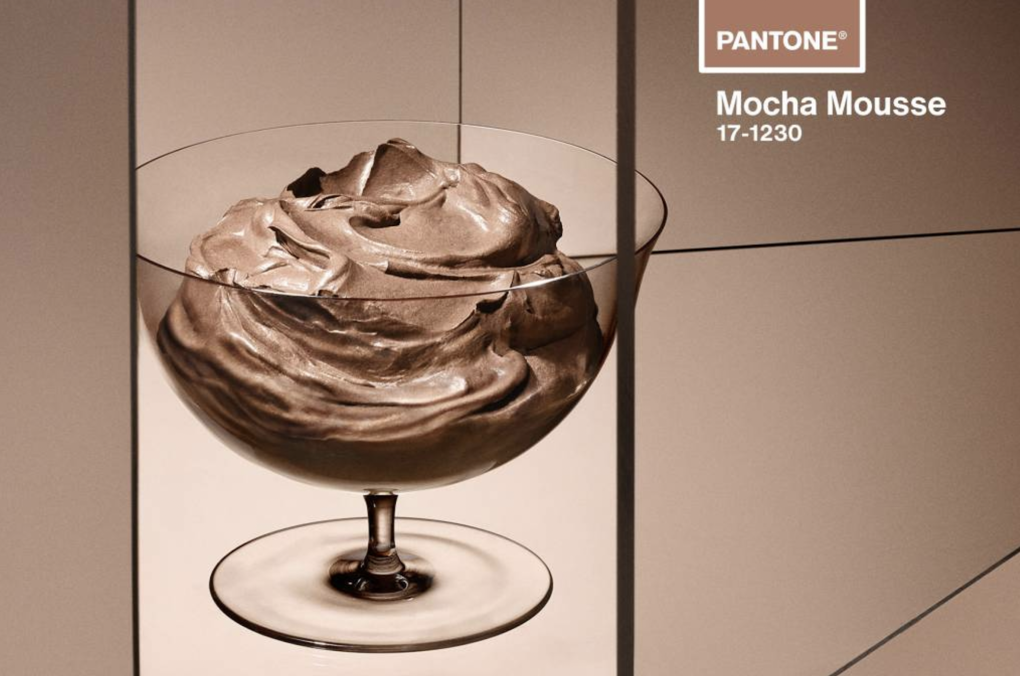 A stylized image featuring a clear cocktail glass of heavily whipped mousse.