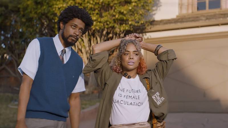 Actors LaKeith Stanfield and Tessa Thompson in a still from 'Sorry to Bother You.' Thompson's white T-shirt reads, 'The Future Is Female Ejaculation.'