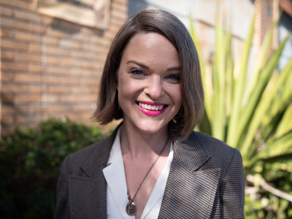 white woman smiles in portrait
