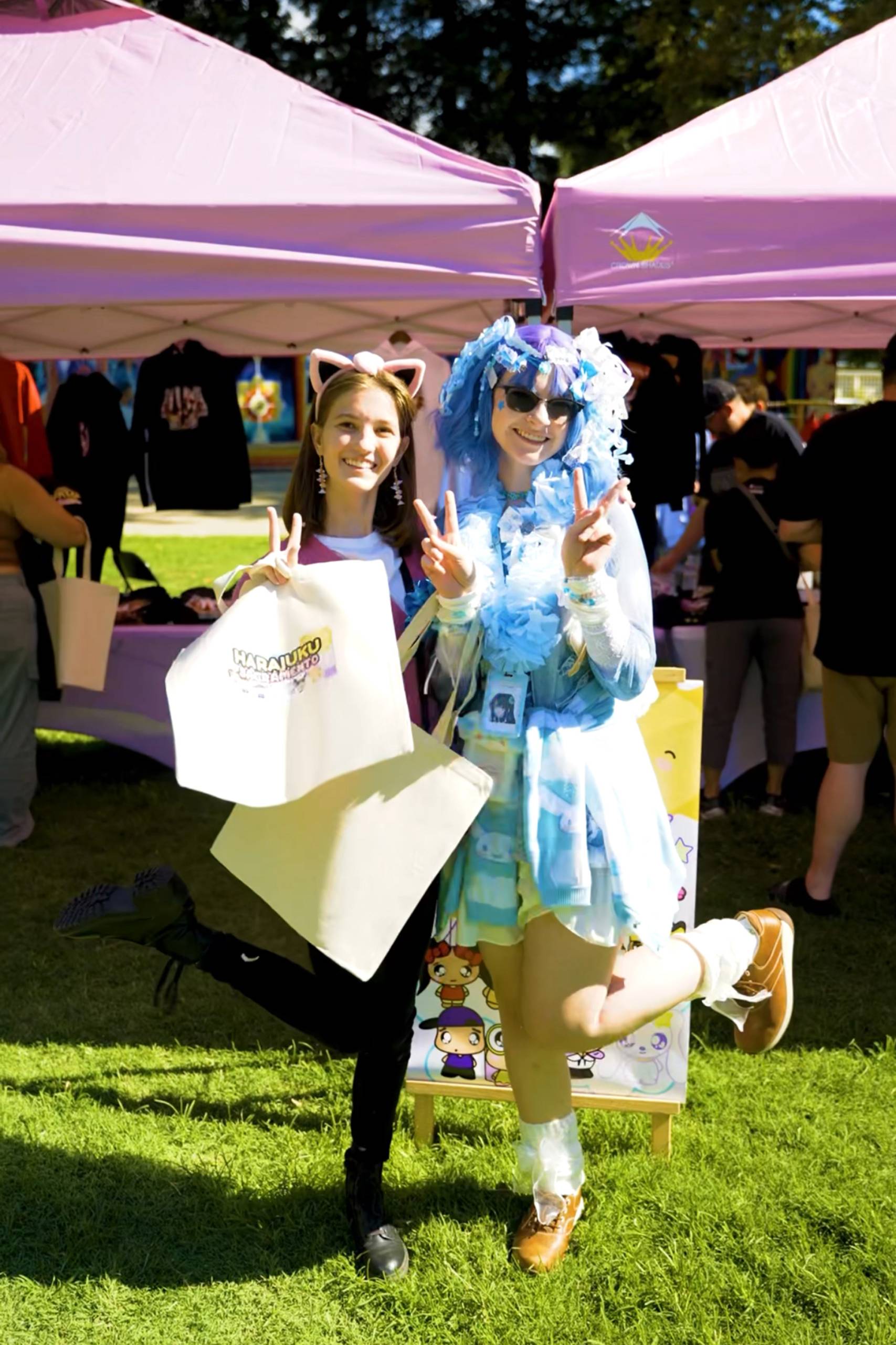 Two festival attendees dressed like anime characters.