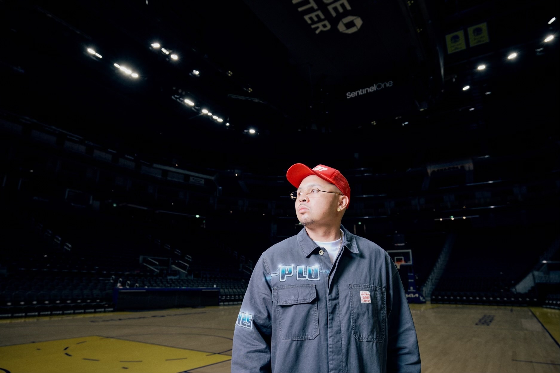 Rapper P-Lo gazes out onto an empty Chase Center.