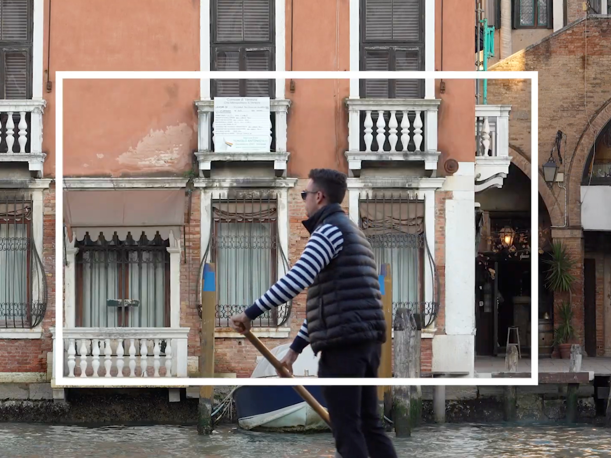gondolier framed within a white rectangle