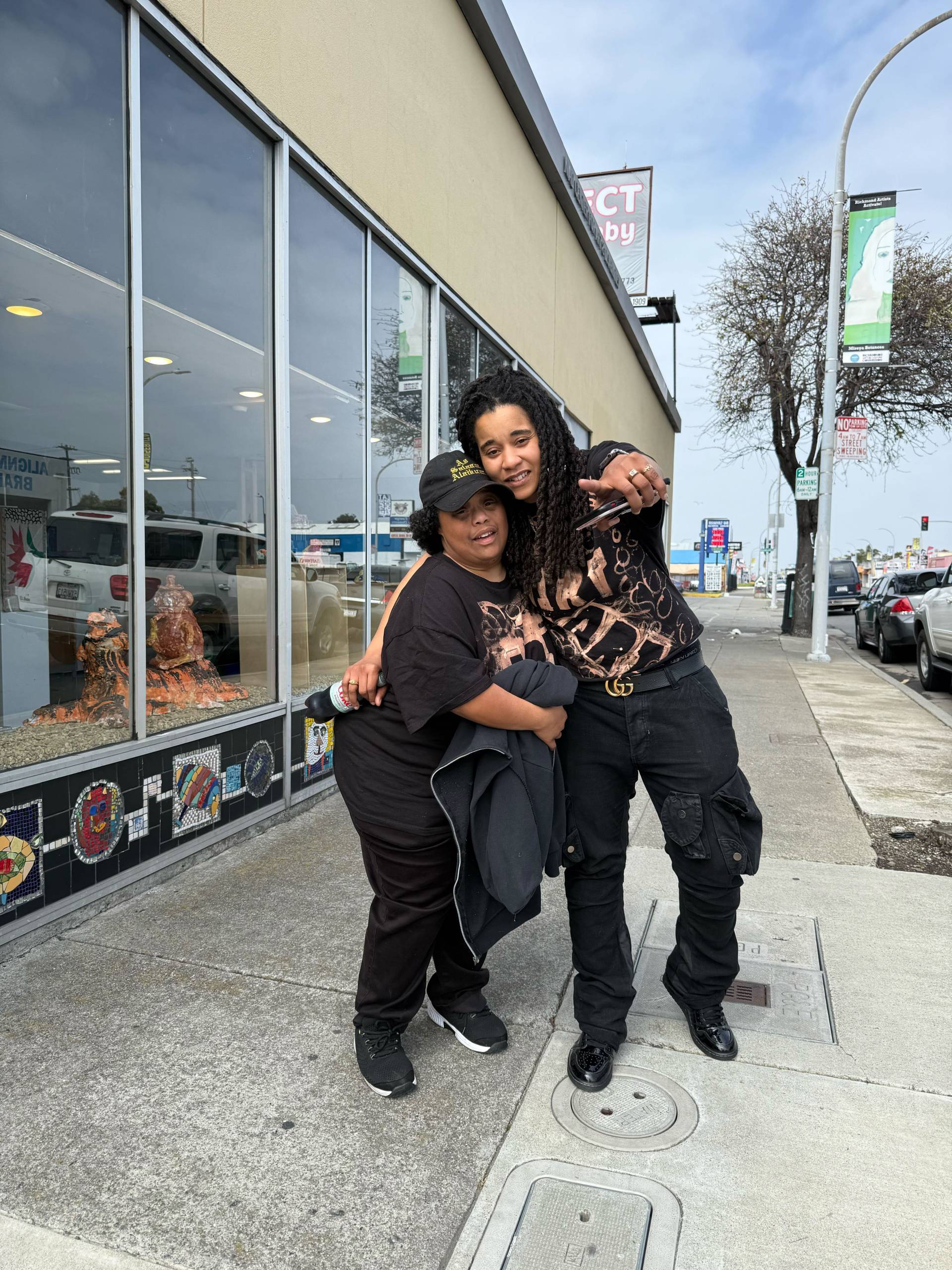 Sisters Halisi Noel-Johnson (left) and Sloane Gross (right) pose for a photo outside of Richmond's NIAD Art Center.