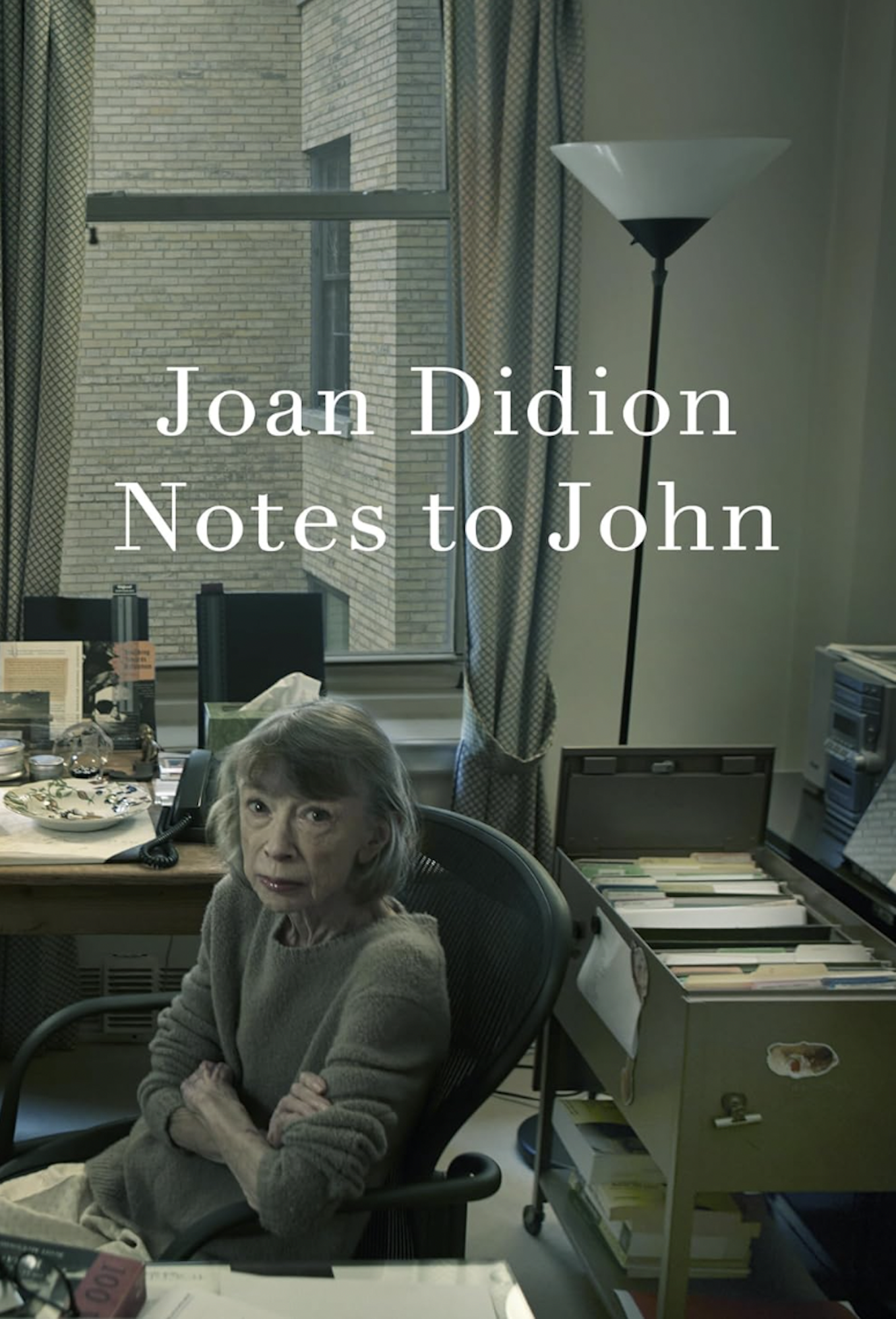 A book cover featuring a photograph of an older woman wearing a wool sweater, sitting at an office desk with her arms folded, an impervious look on her face. 