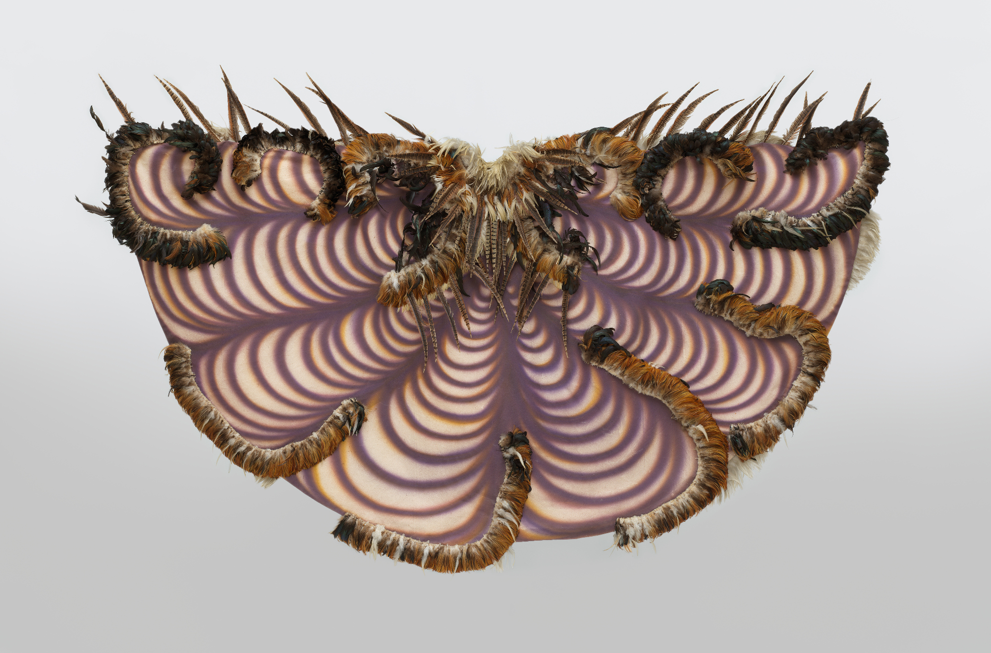 feathered and spray-painted half-circle painting, like cloak