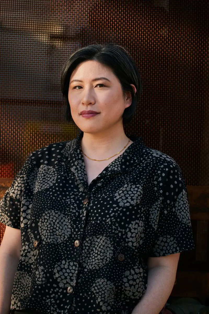 woman in dark button-down shirt