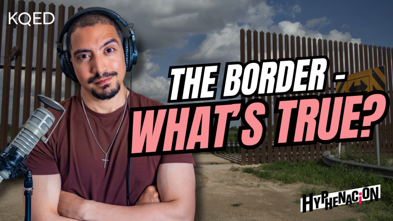 Person wearing maroon shirt with their arms crossed standing behind a microphone with text "The Border - What's True?"