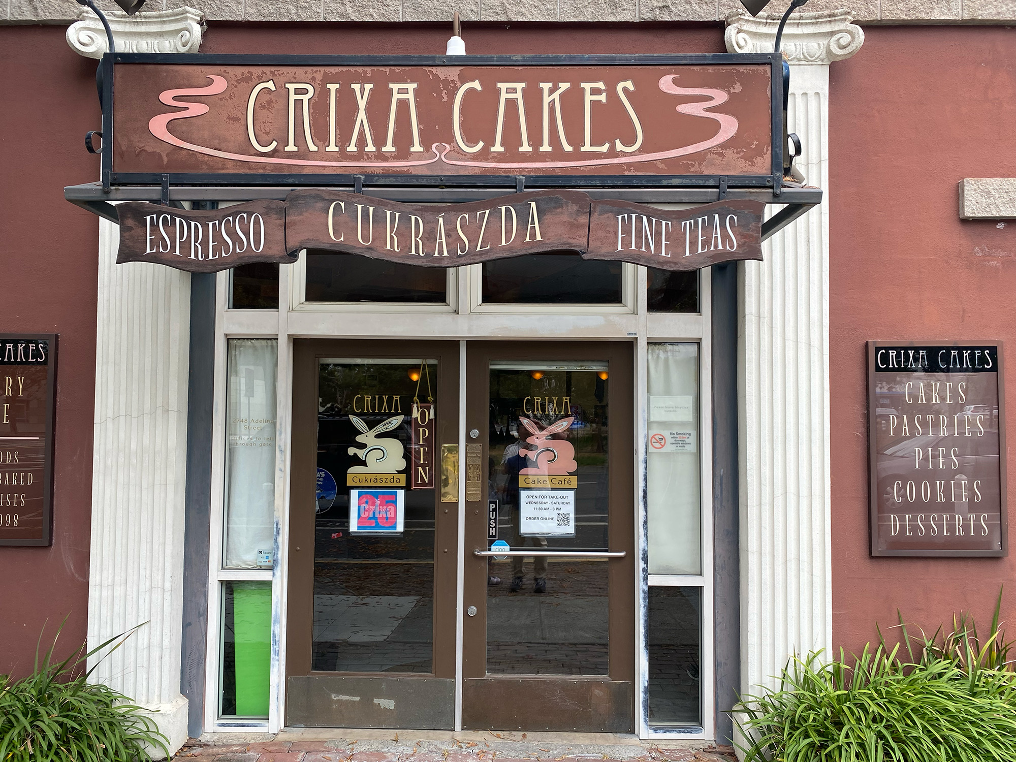 Exterior of bakery. The sign reads "Crixa Cakes."
