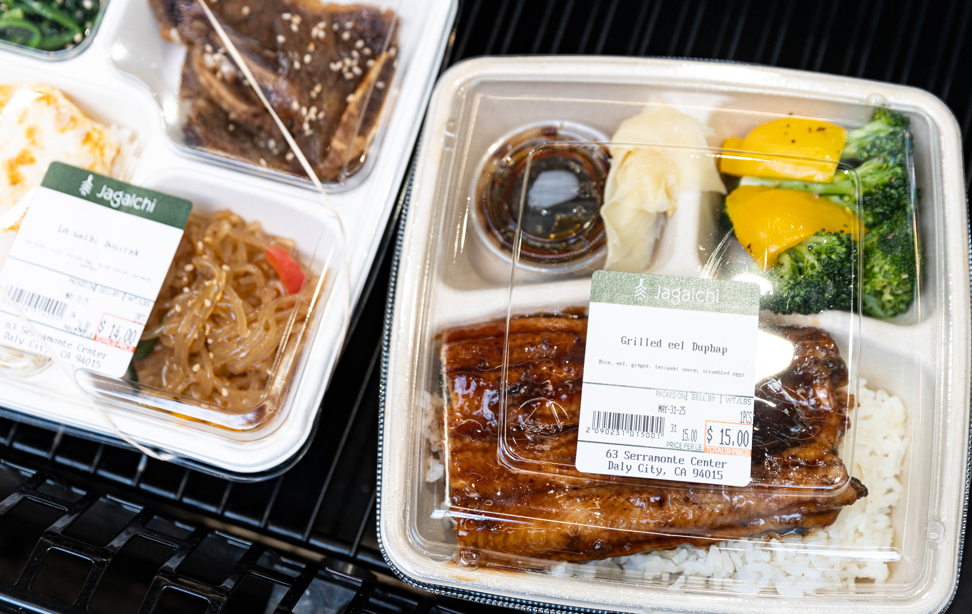 Packaged grilled eel lunchbox from an Asian grocery store.