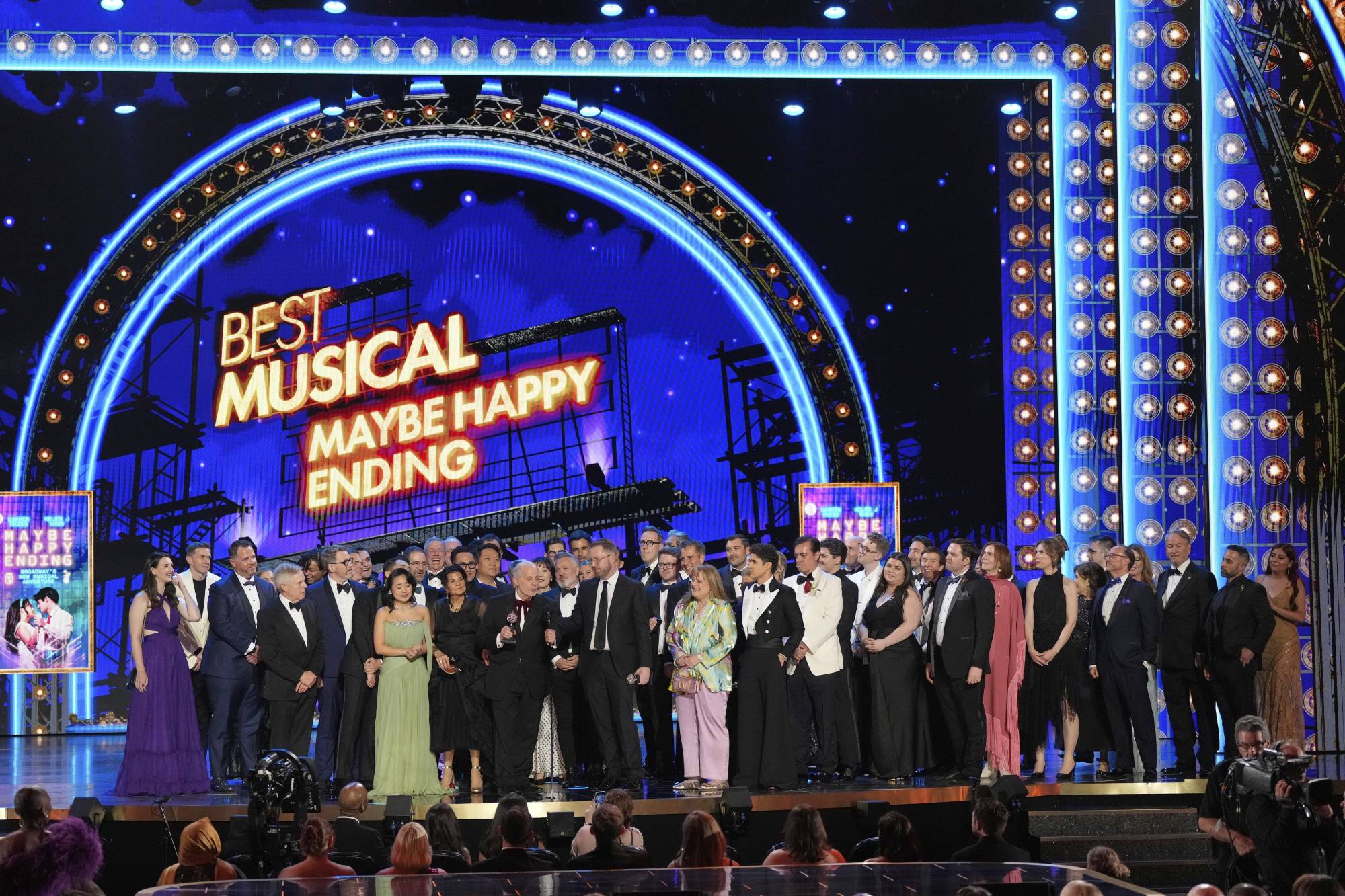 The cast and crew of Maybe Happy Ending accept the award for Best Musical during the 78th Tony Awards.