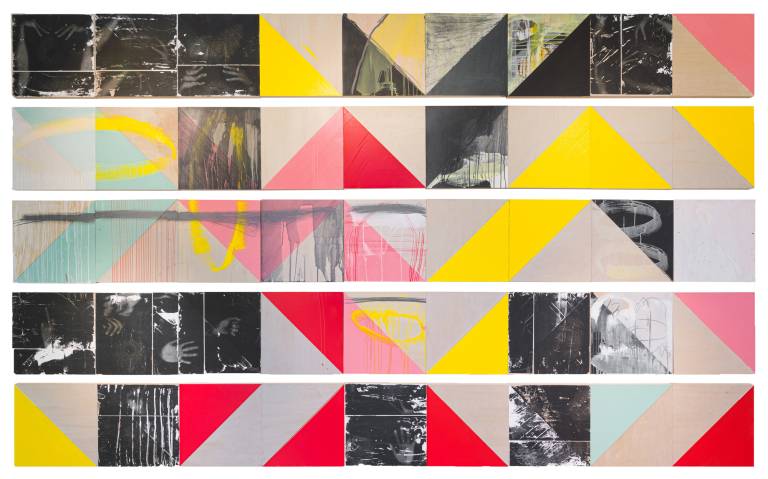 rows of multicolored square prints with zigzag patterns formed in yellow and pink