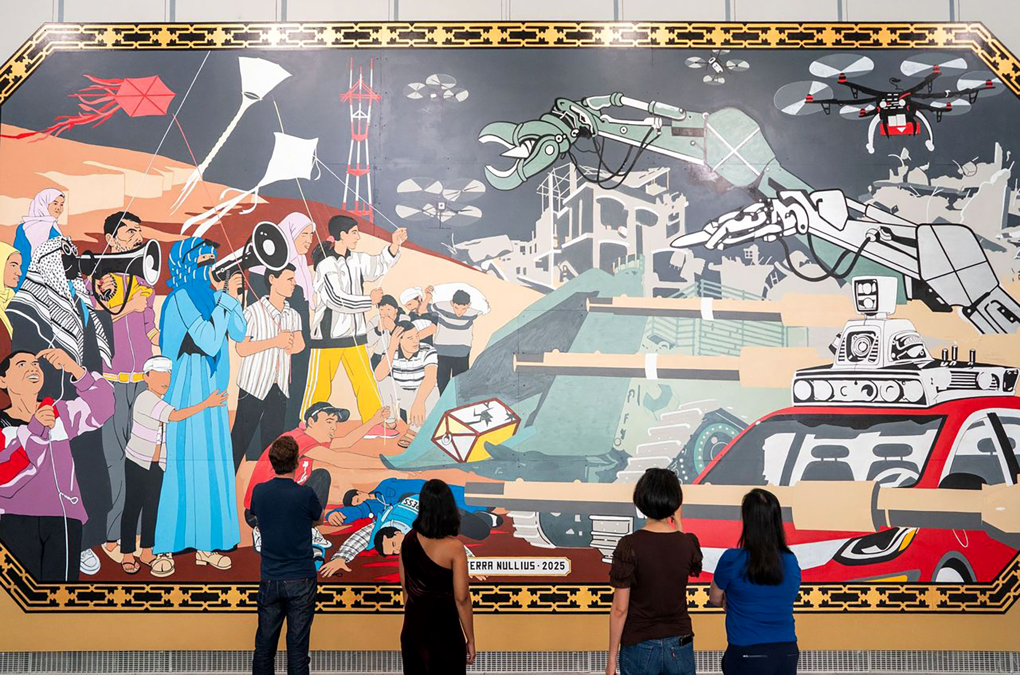 four people stand in front of a mural depicting scenes from Gaza and San Francisco, including Palestinians using bullhorns, self-driving cars, journalists being trampled and a tall red and white tower