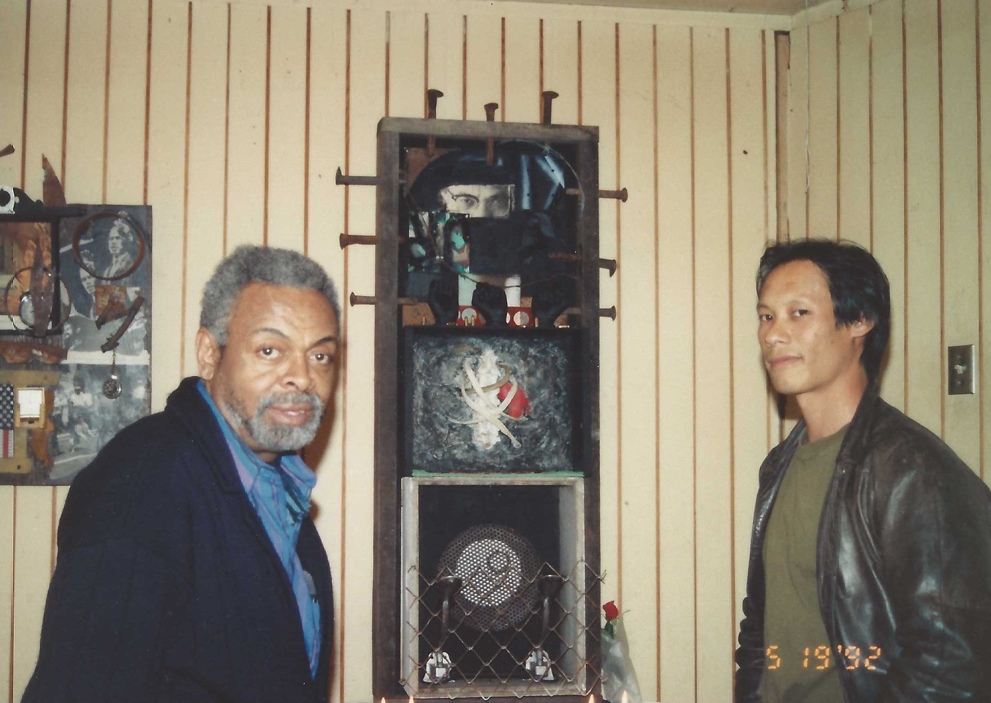 Two men pose for a photo