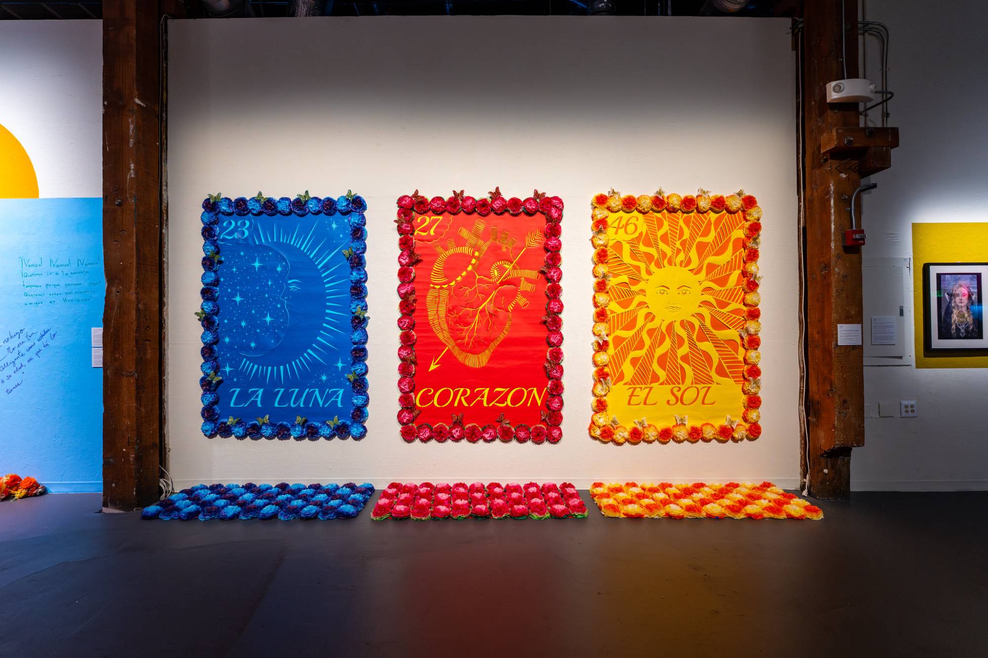 A blue, red and orange art display mounted in an art gallery. 