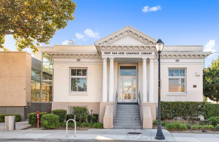 small temple-style building with library name over door