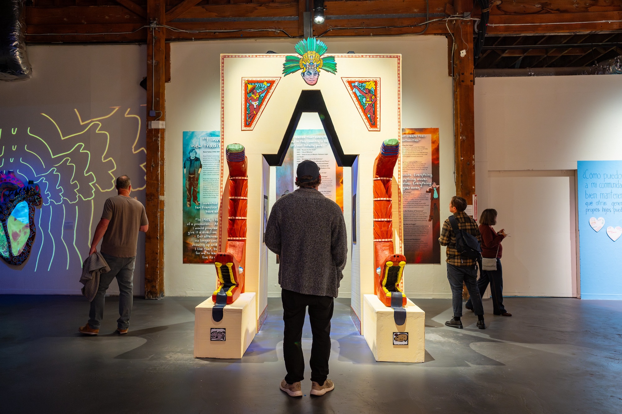 A person walks through an instillation at an art gallery.