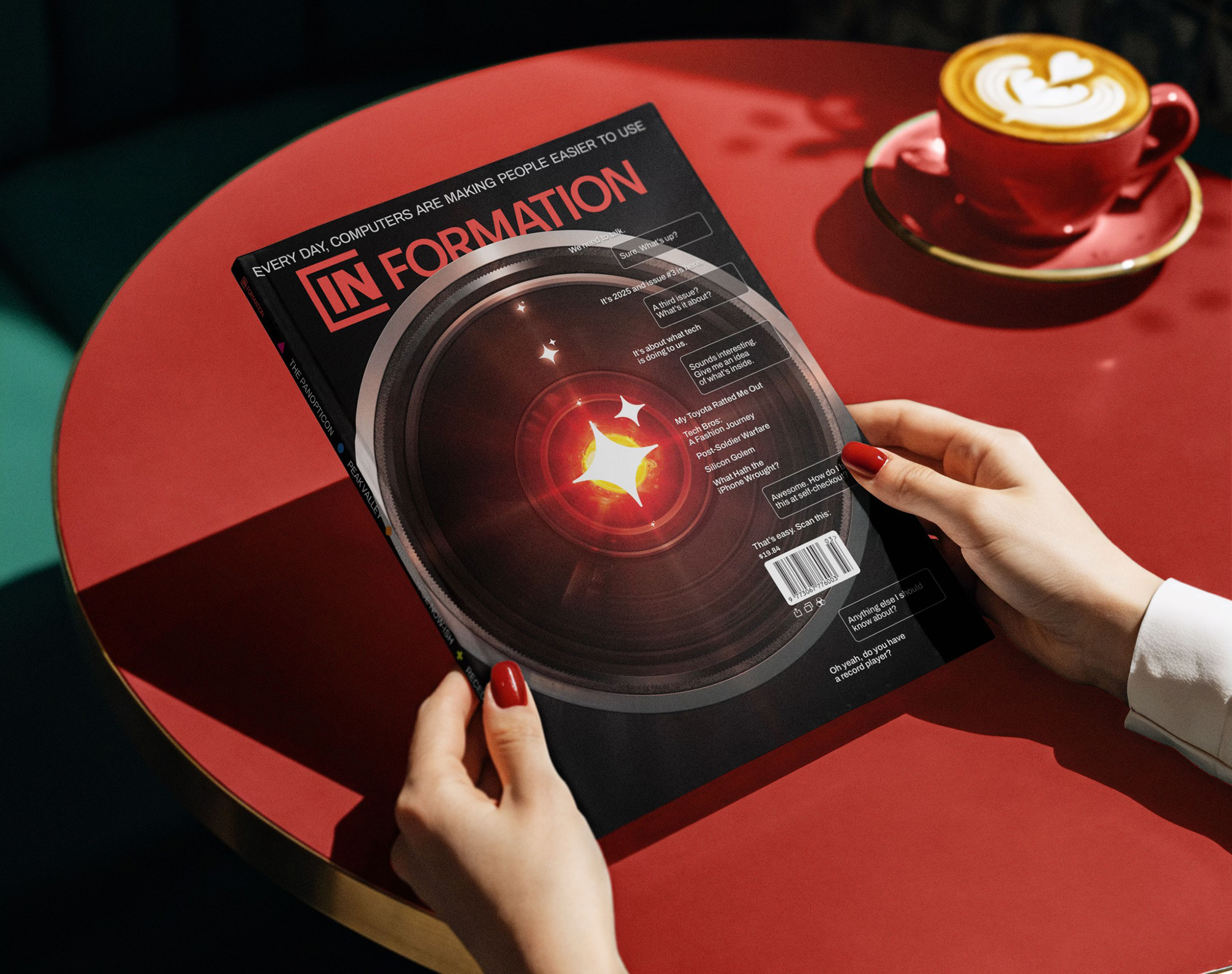 A magazine cover depicting the close up of a camera lens, its center burning red with light.