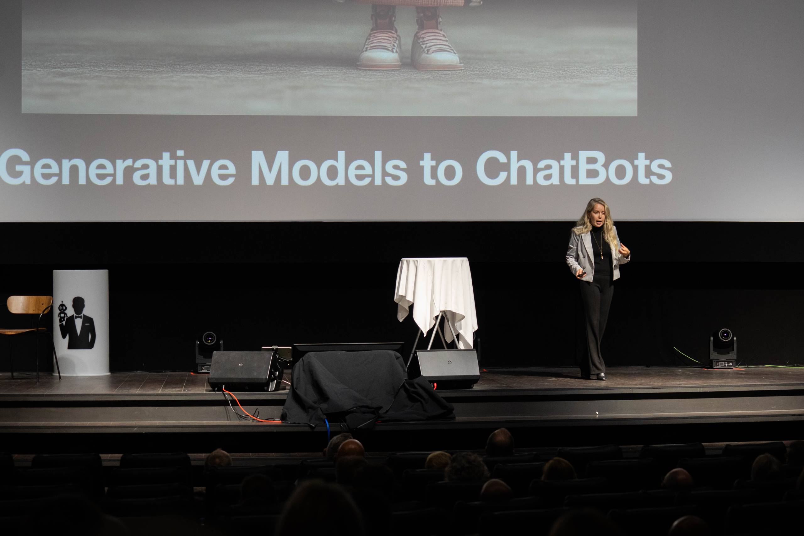 An academic speaks at a tech conference.