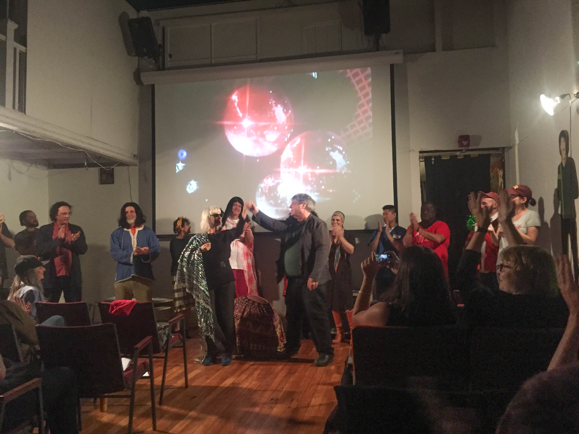 crowd of people in front of audience, all cheering