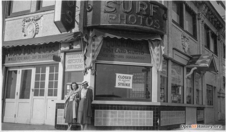 a black and white photo of women standing outside 'surf photo'