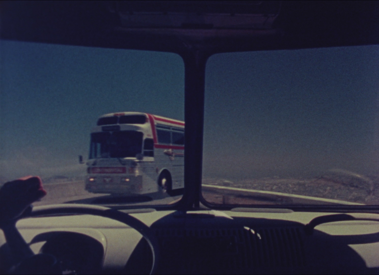 image through split windshield of oncoming bus
