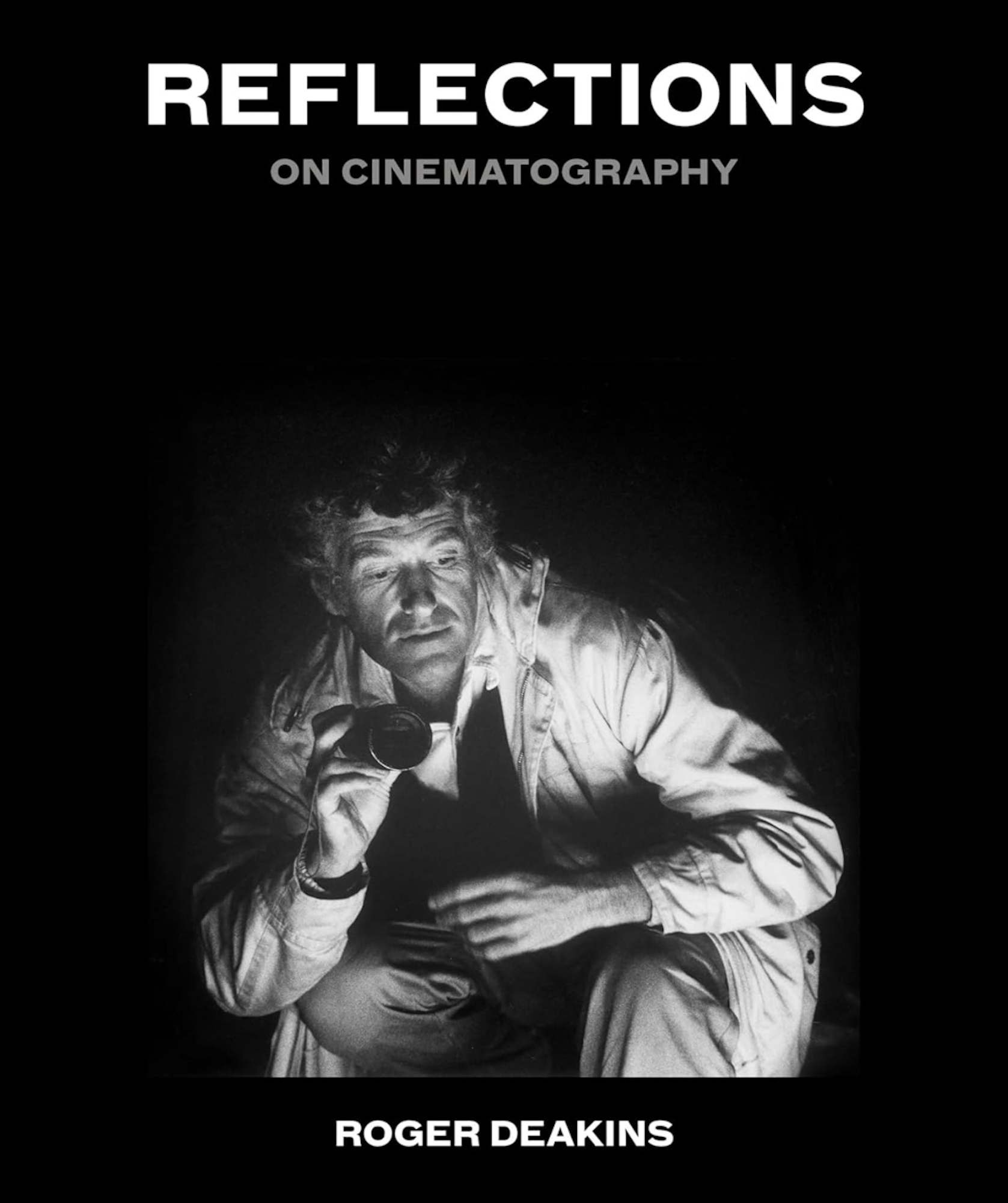 A book cover featuring a black and white photo of an older white man crouching down against a black backdrop.