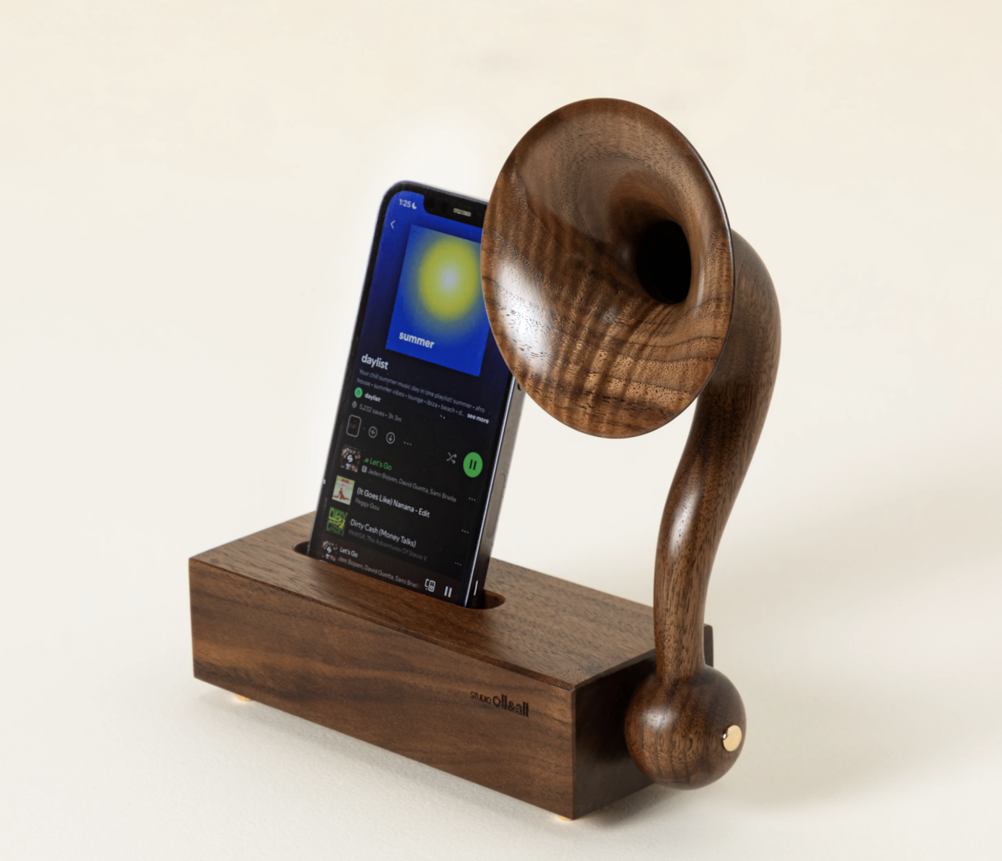 A wooden phone stand with a mini gramophone speaker attached. 