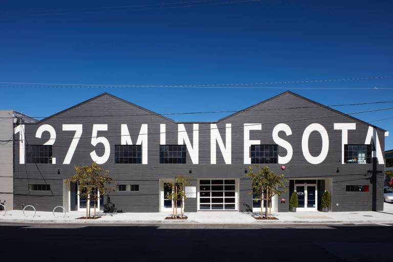 gray warehouse with large address painted in white