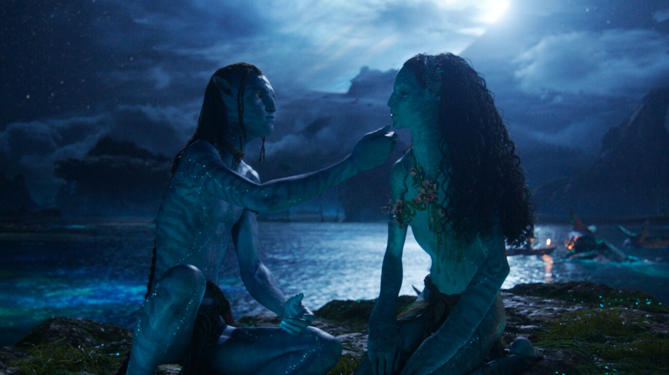 two aliens sharing a moment on shore under moonlight