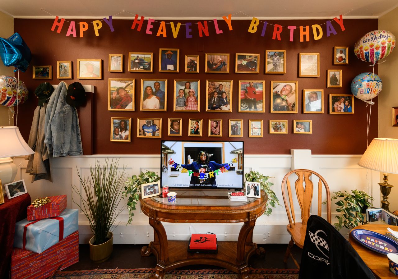 A colorful photo showing a wall of framed images and a banner that reads "happy birthday"