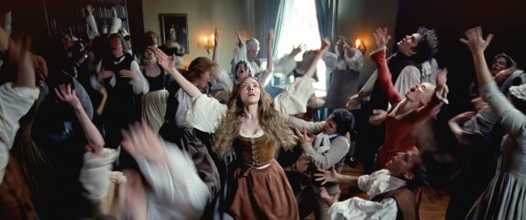 group of people in 18th-century clothes with arms extended in ecstatic dance