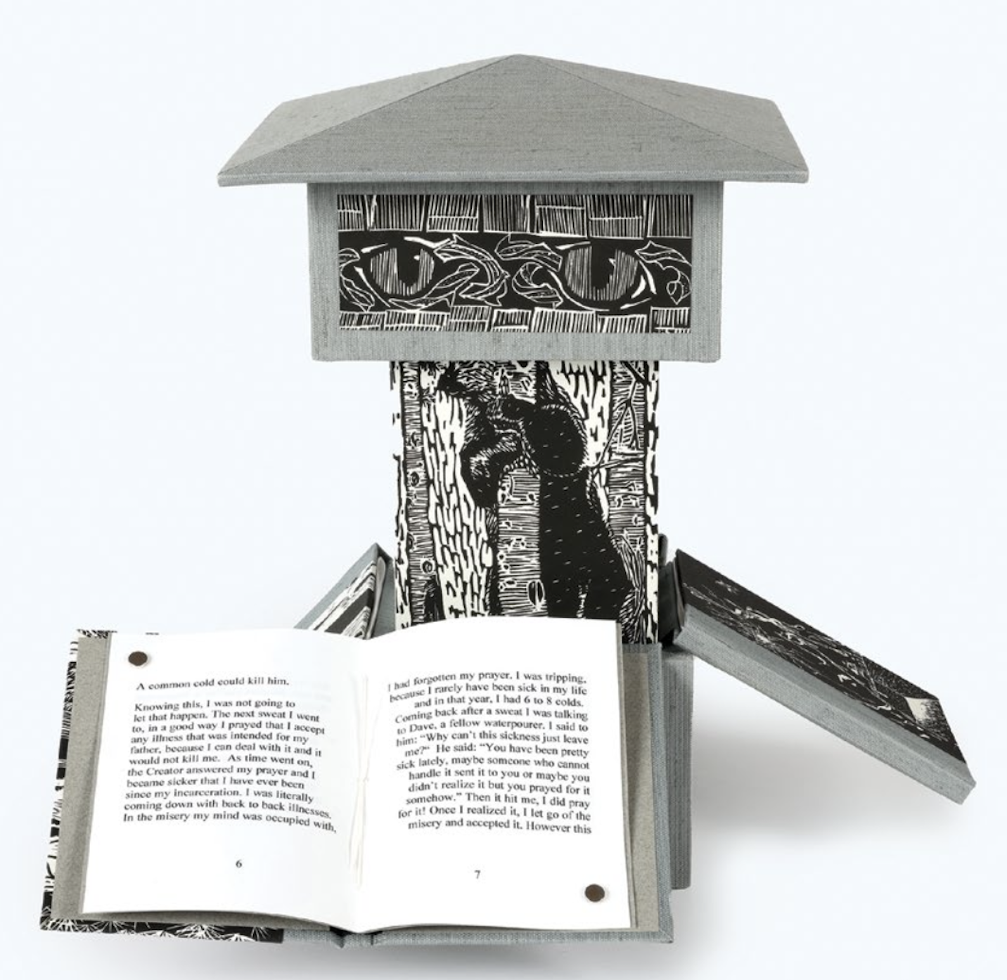 An artist's rendition of a prison guard tower constructed out of screenprinted materials with four books unfolding from the central column.