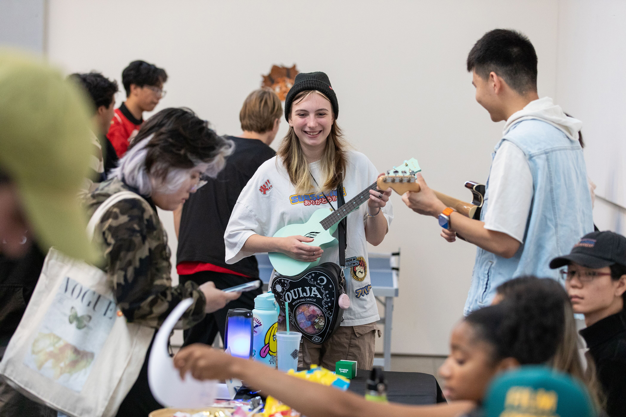 young people crowded together smiling in candid shot