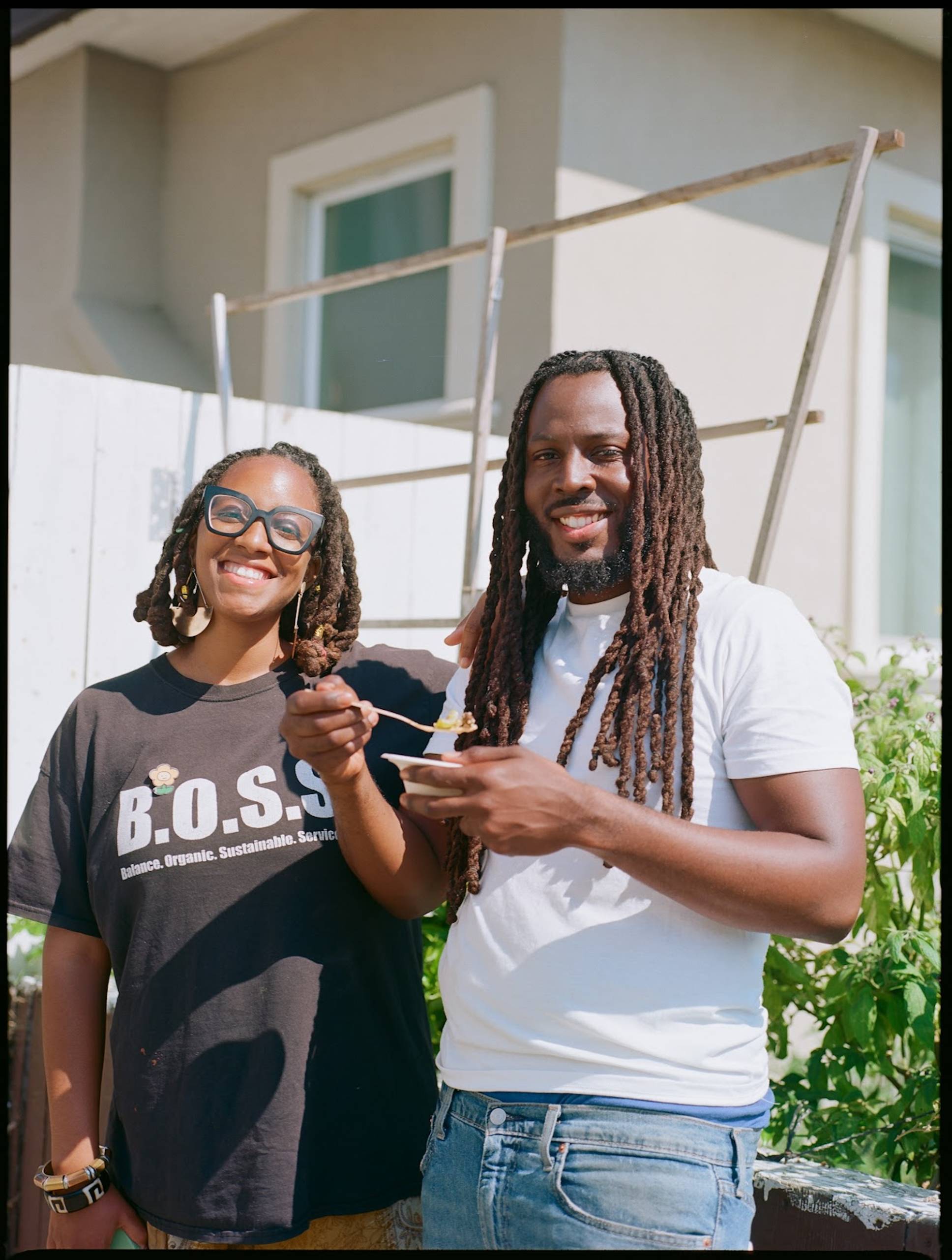 Two African-American people, a woman and a man, pose for a photo. 