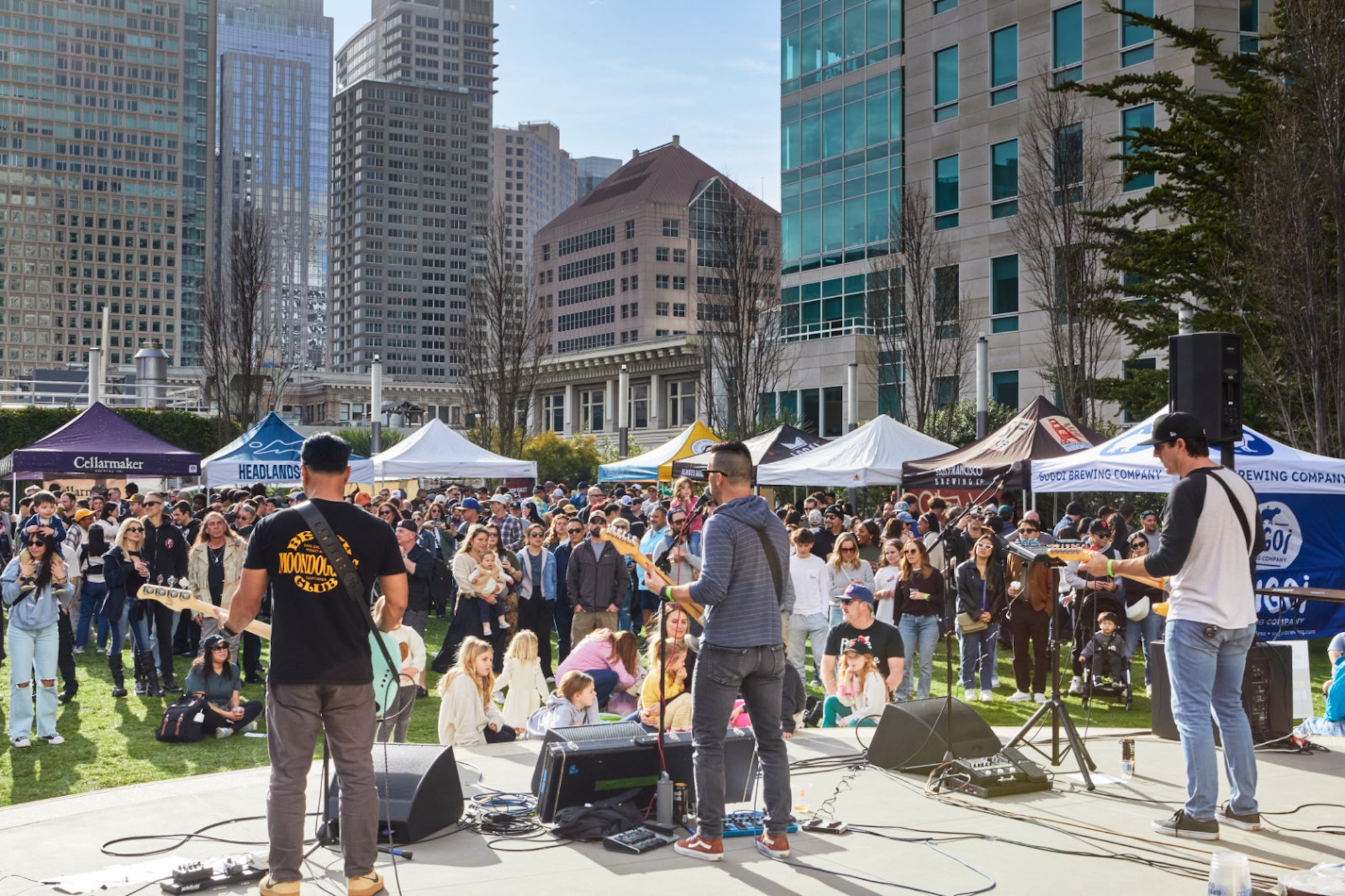 Musicians playing on a stage outside in San Francisco. 