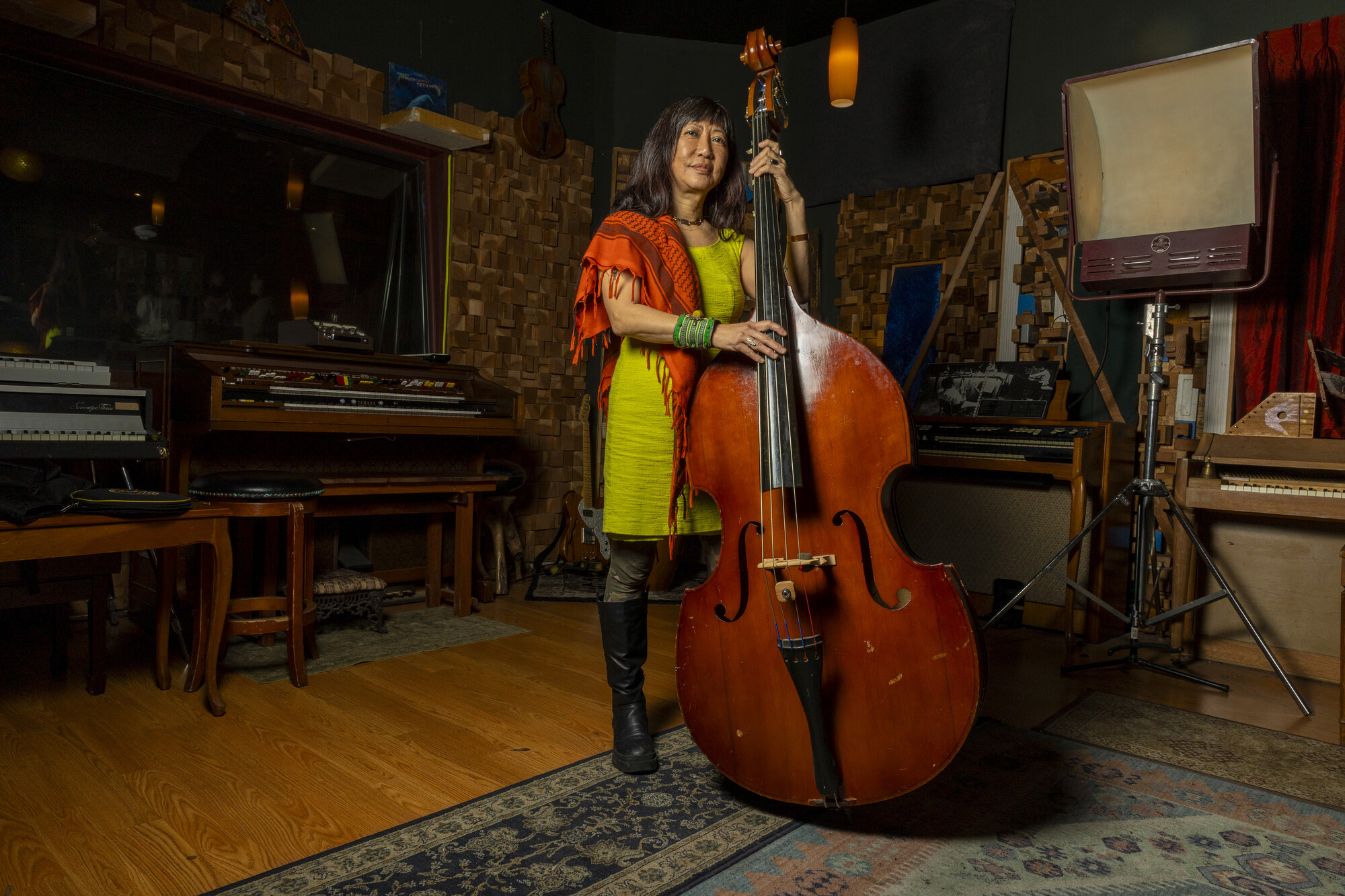 Caroline Chung poses for a portrait wearing a Keffiyeh, a traditional square scarf now modernly worn by both Palestinian and non-Palestinians as a form of solidarity.