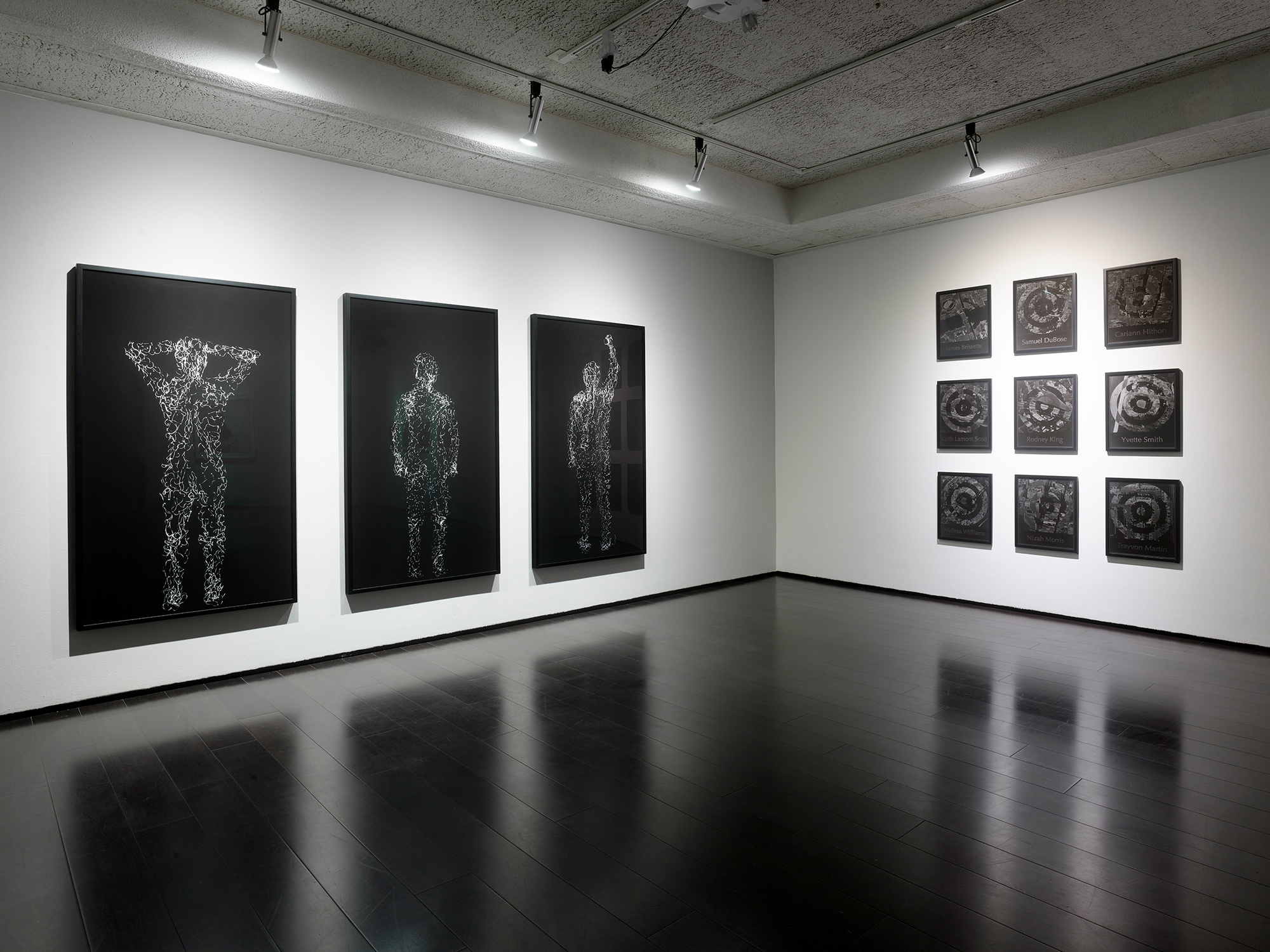 gallery with framed black and white photographs on walls