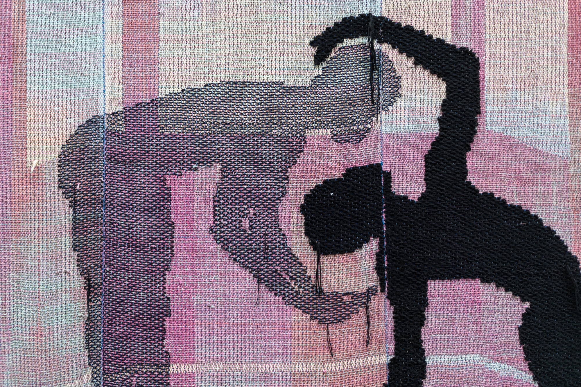 black silhouette and gray silhouette bend around each other