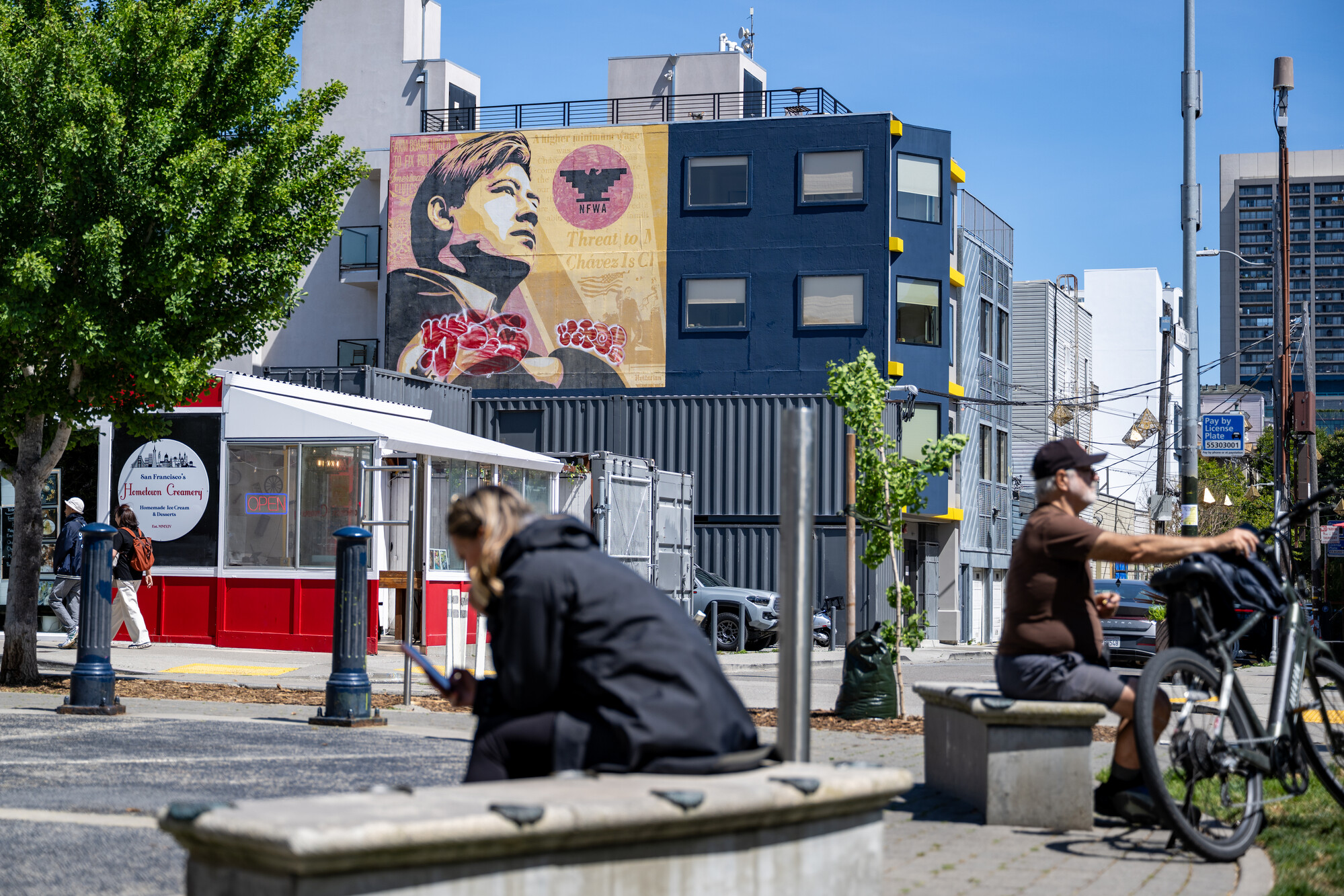 reddish orange mural on building in background