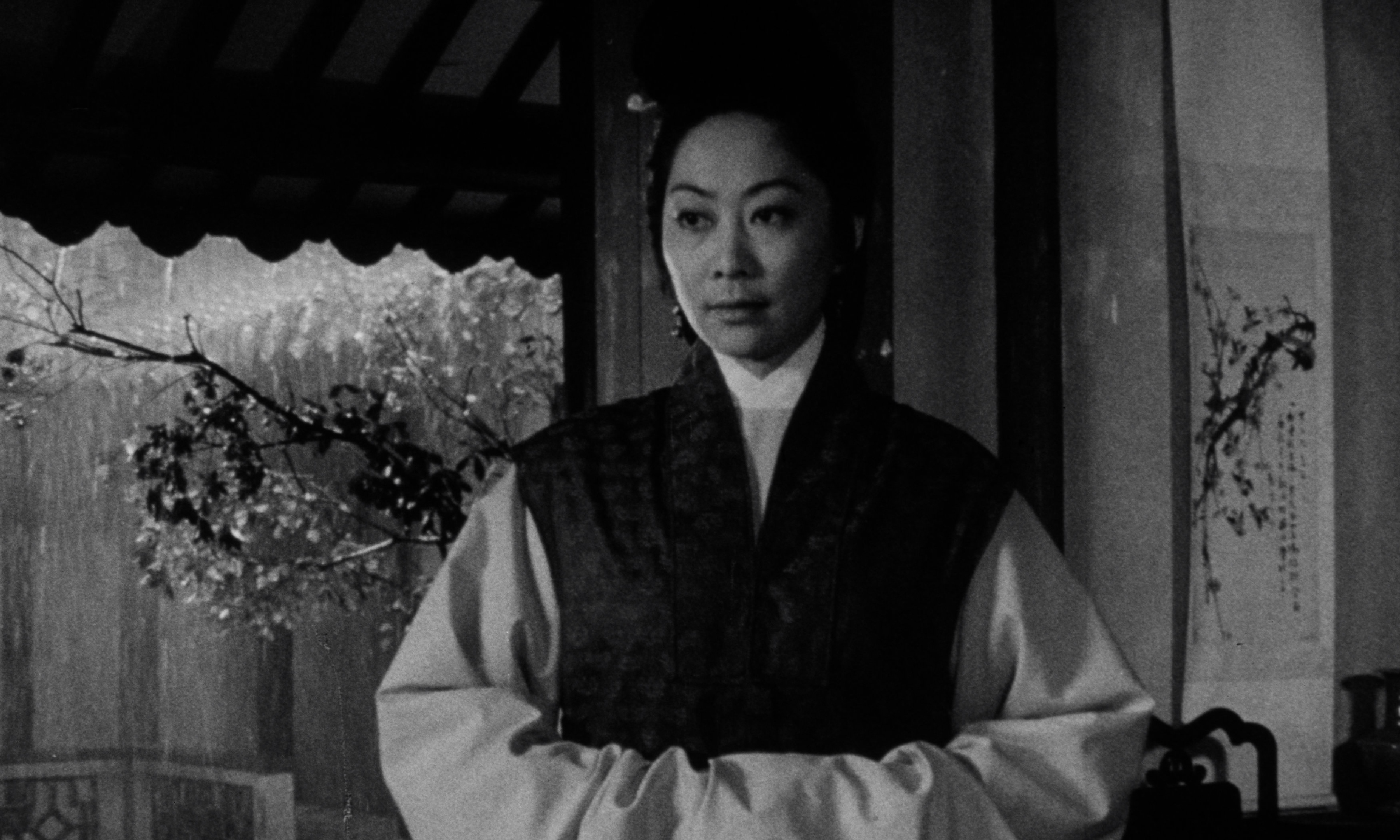 black-and-white image of woman with hands together