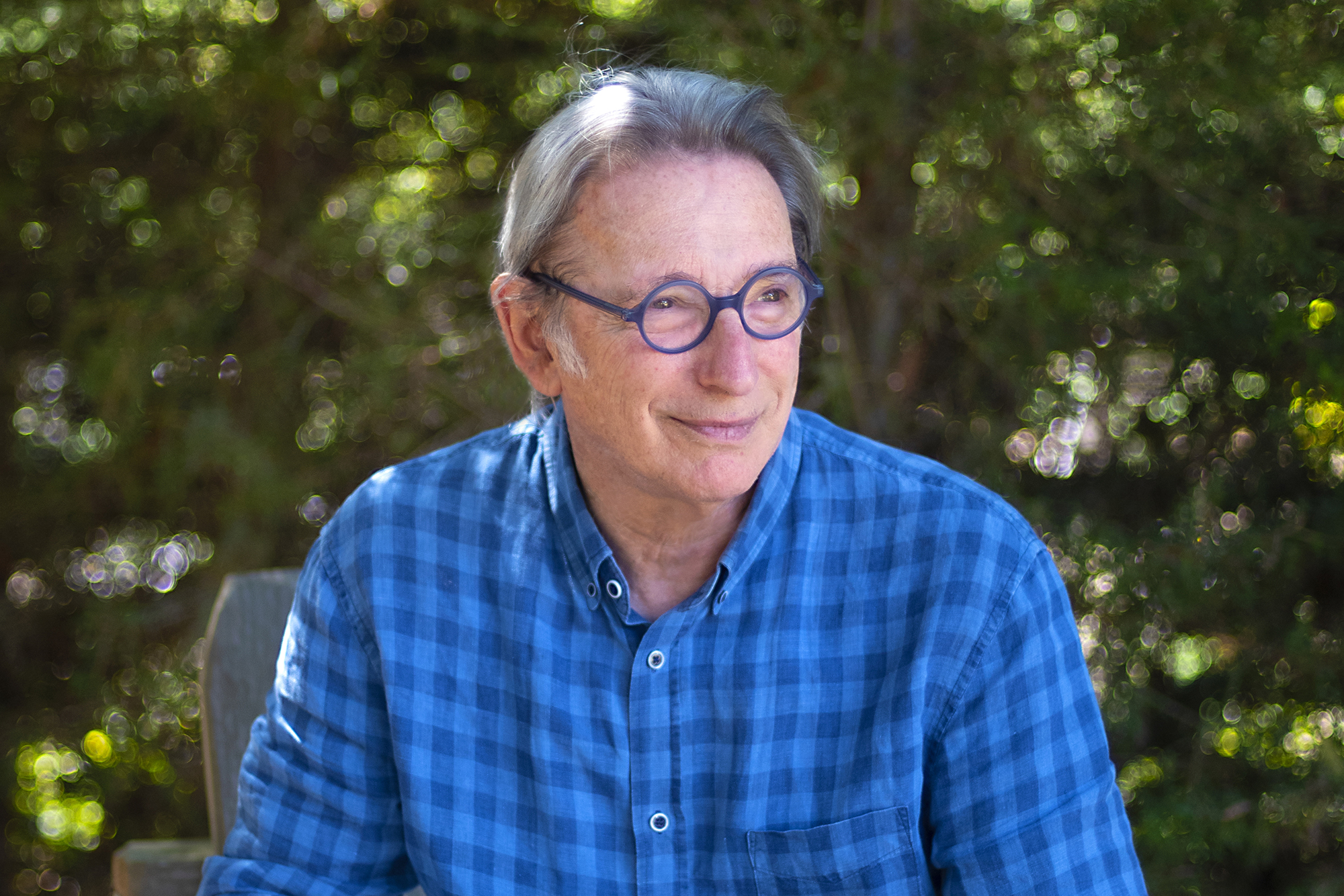 A man in blue shirt looks to the right