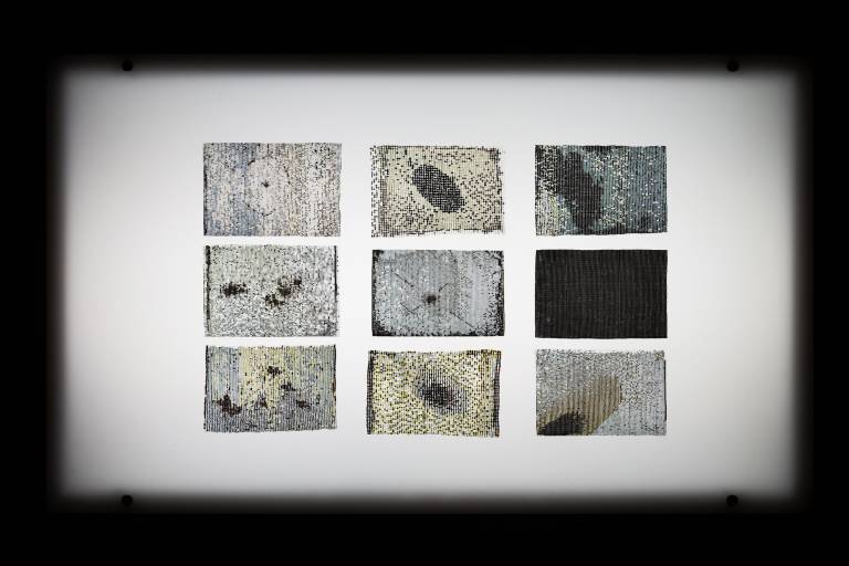 nine beaded sections on light table