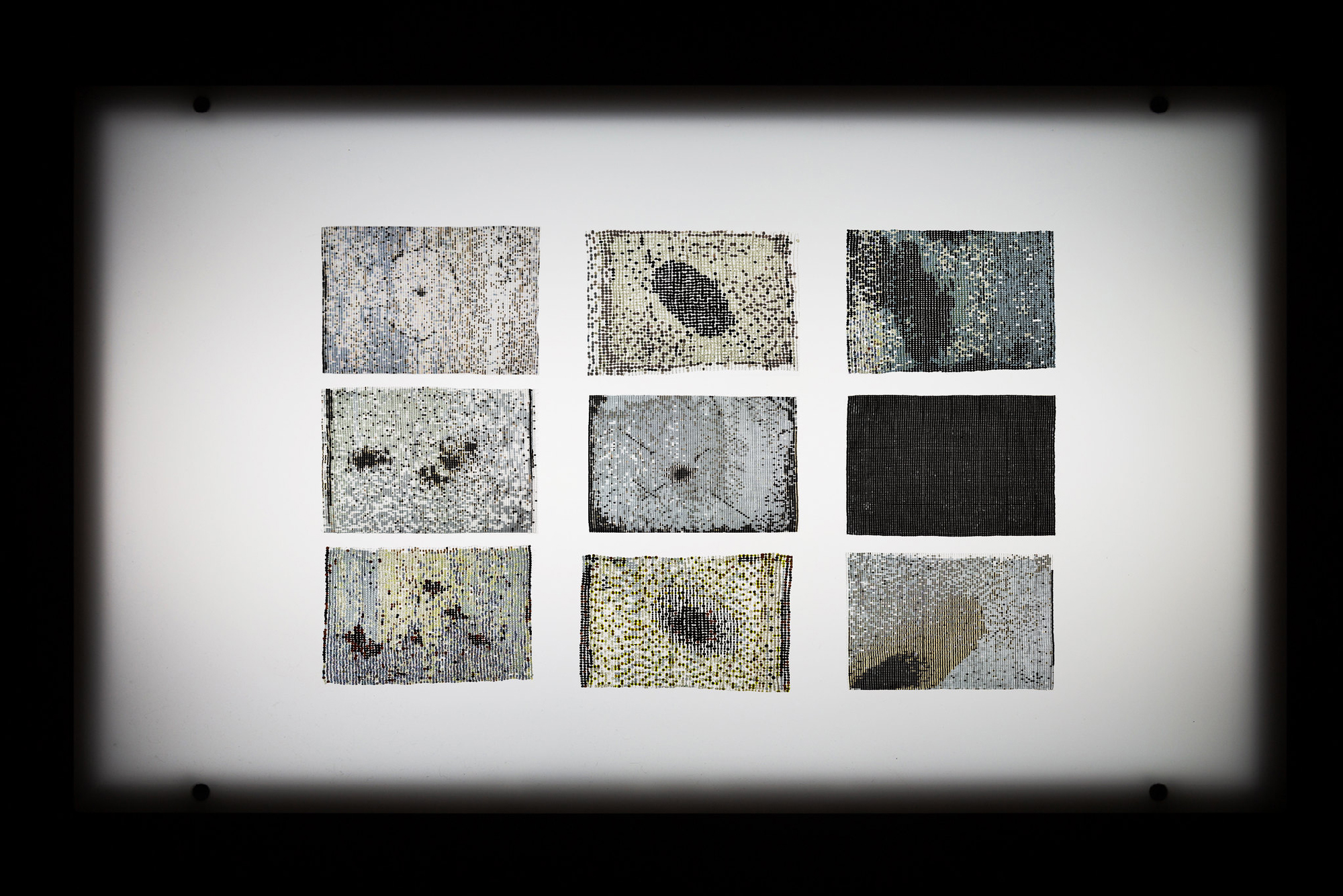 nine beaded sections on light table