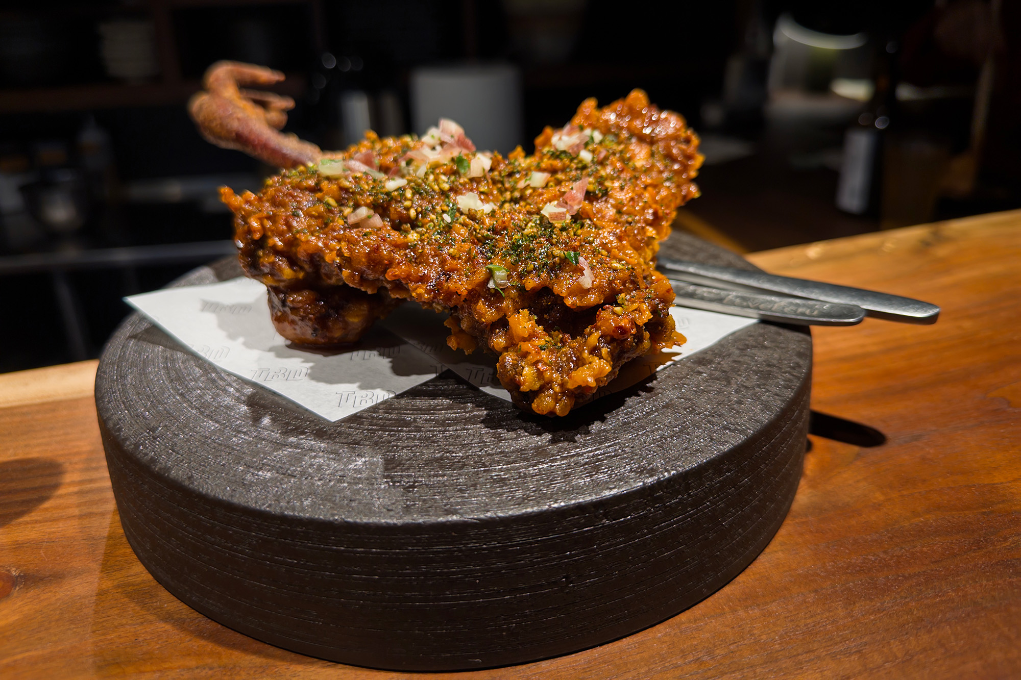 Japanese-style fried chicken leg, served with the claw still attached.