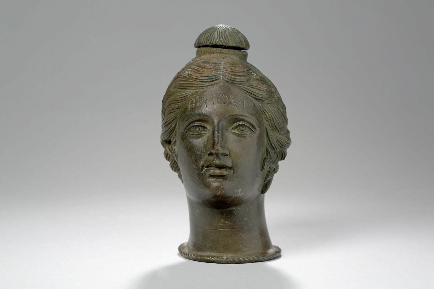 woman's head with inscription on forehead