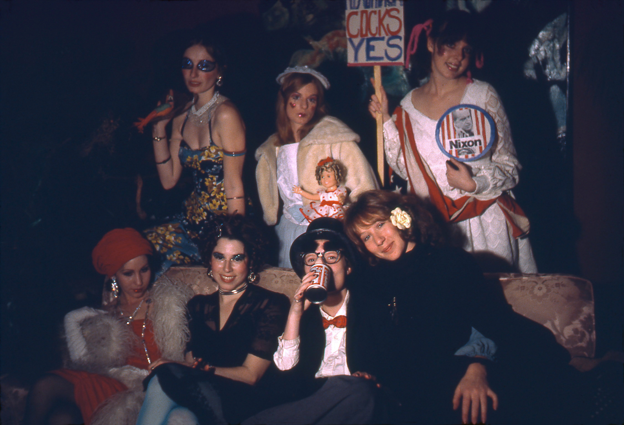 women in costumes with signs